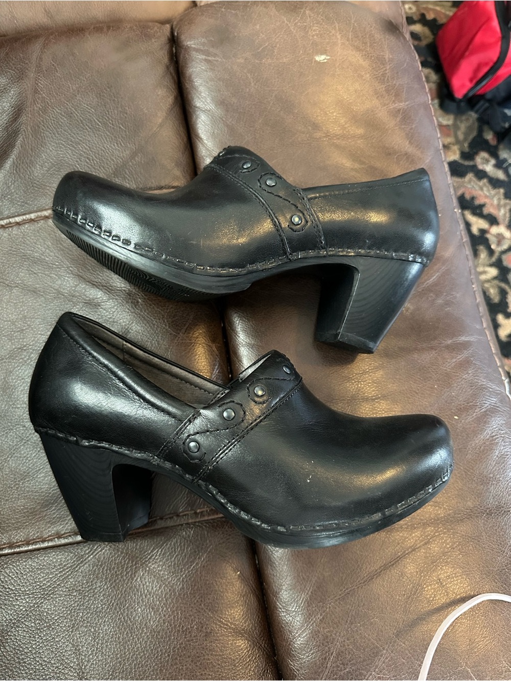 Dansko Black Leather Heeled Clogs with Studded Strap